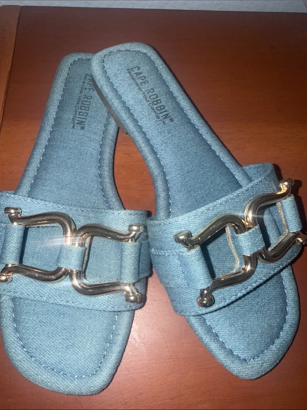 Blue Denim sandals with gold metal.